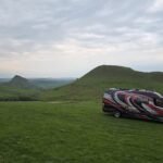 Campervan pitched with views of Chrome Hill and Parkhouse Hill in the Peak District